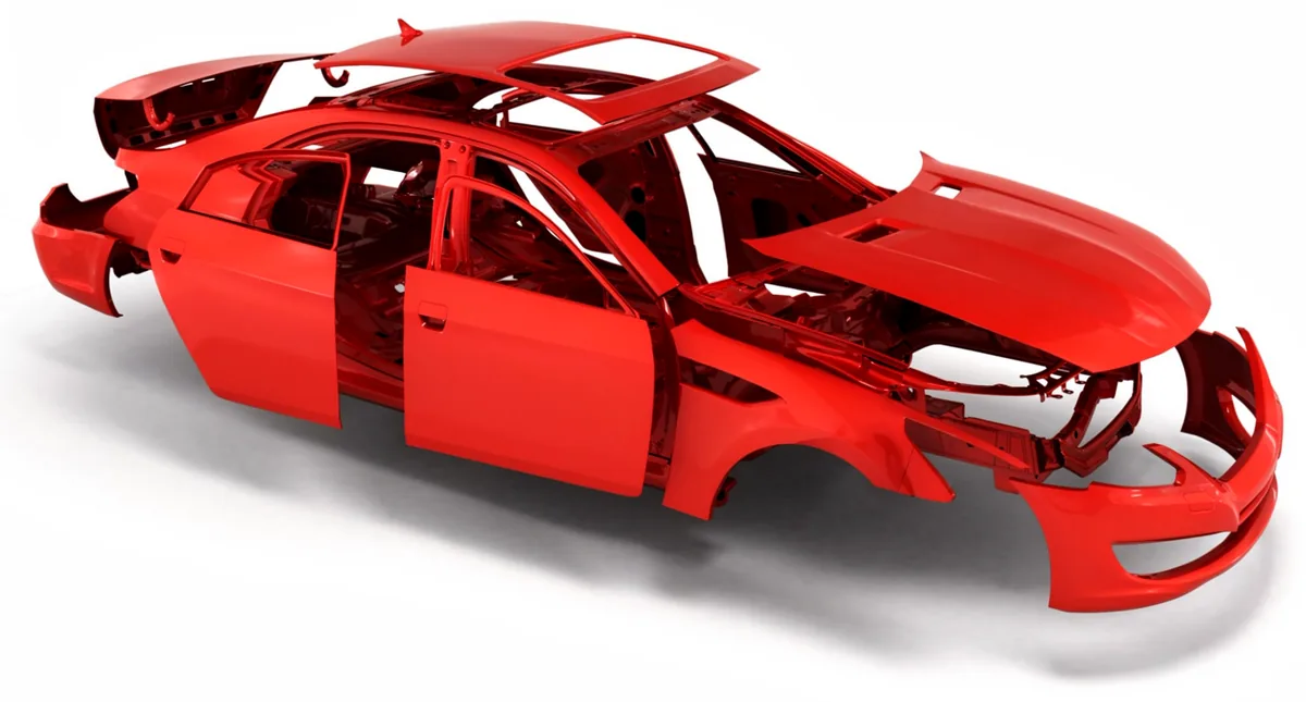La carrocería de un coche, en rojo, sin llantas ni motor